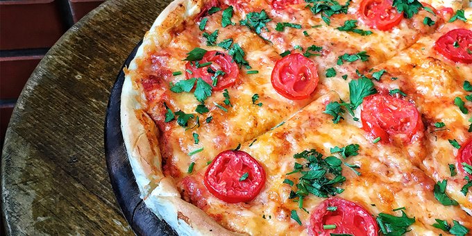 Pizza margarita at the celentano pizzeria in dnipro. order with a discount